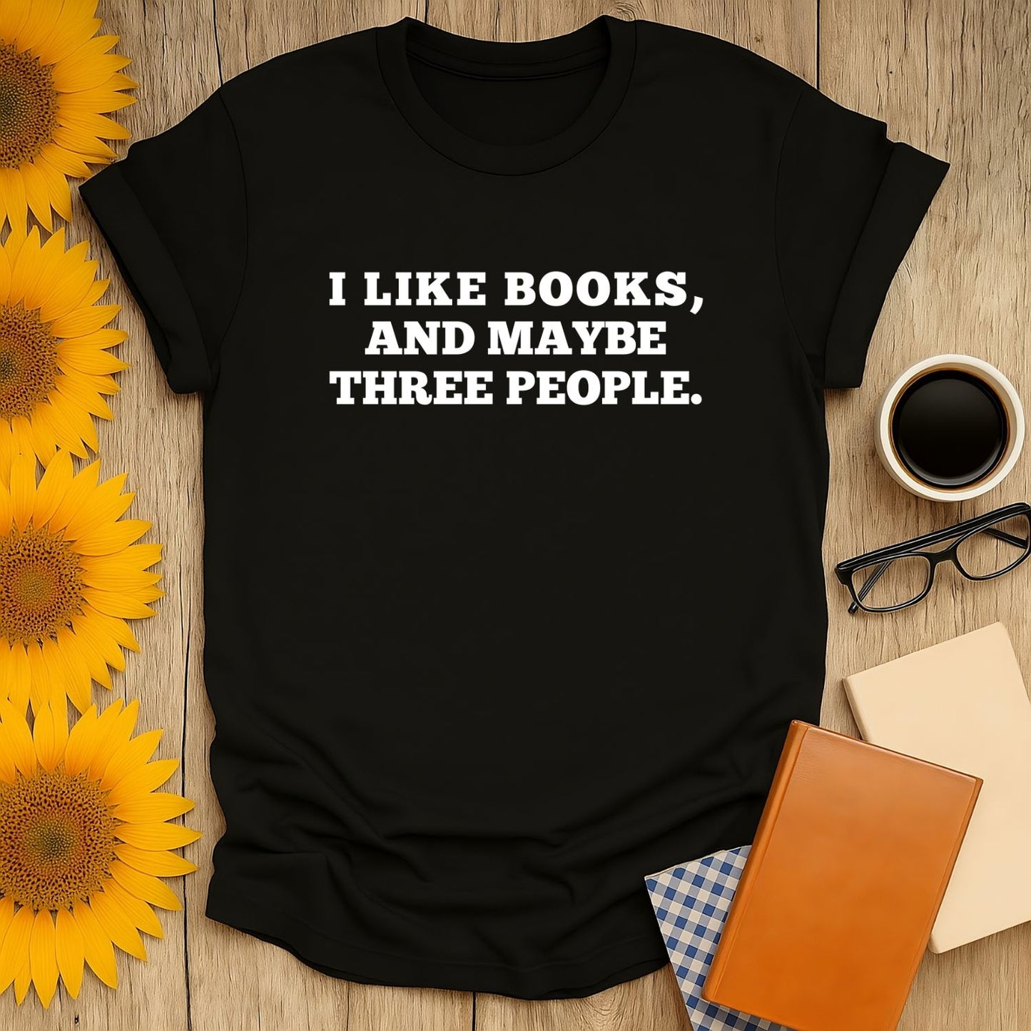 Book lover shirt featuring bold text: 'I LIKE BOOKS, AND MAYBE THREE PEOPLE.' Perfect gift for cozy readers!