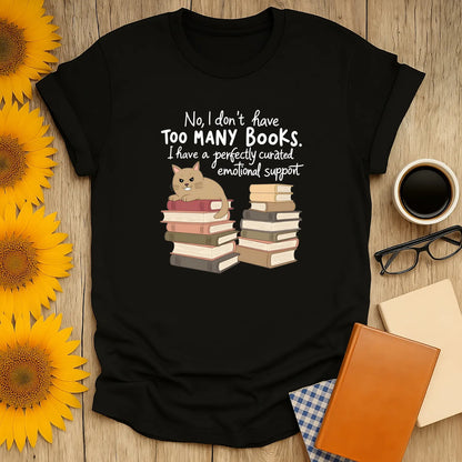 Emotional Support Books T-Shirt featuring a cat and stacks of books. Cozy reading aesthetic, relaxed fit unisex tee for bibliophiles. 📖