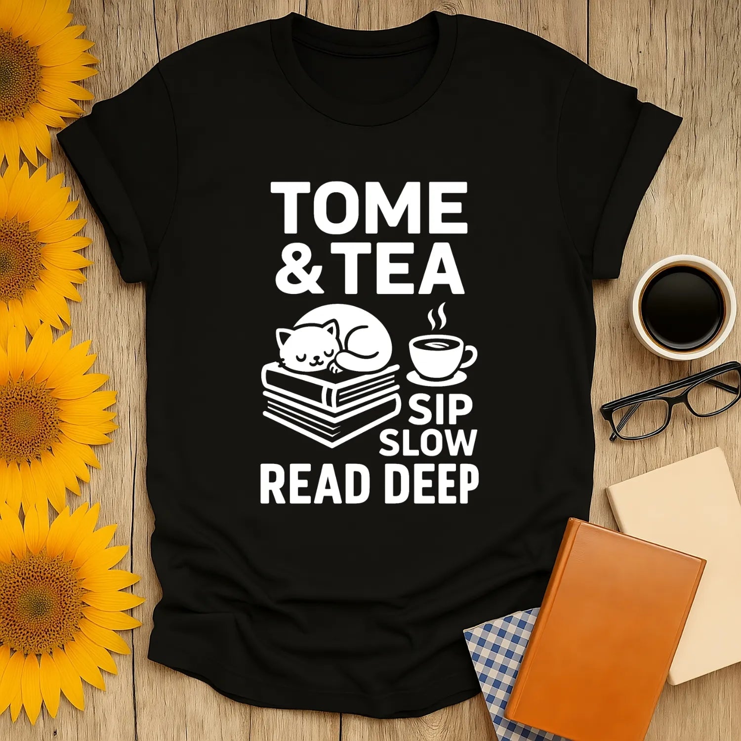 Tome & Tea t-shirt with a napping cat on books and a steaming cup. Perfect for book lovers who enjoy cozy reading and tea.