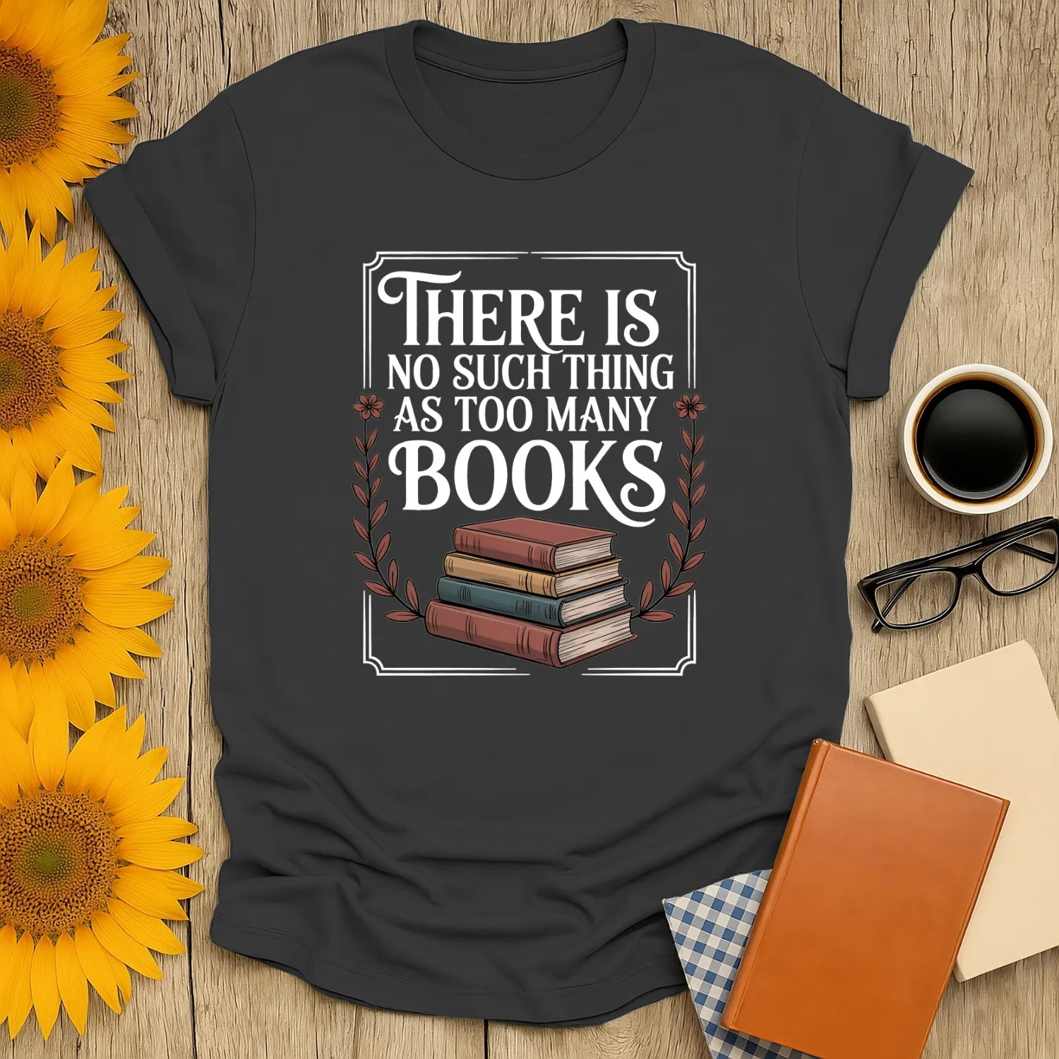 Funny reading tee featuring stacked books and text "There is no such thing as too many books"—perfect for cozy book lovers.