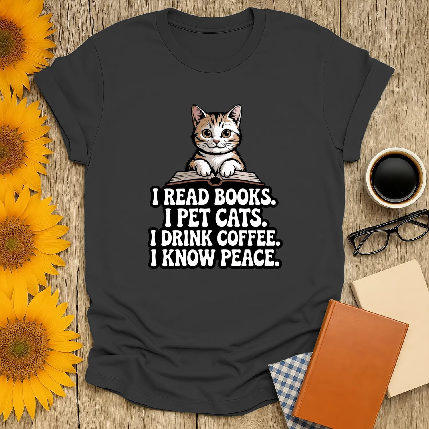 Cozy bookworm t-shirt featuring a cute cat and witty text: 'I read books. I pet cats. I drink coffee. I know peace.' Perfect gift for readers!