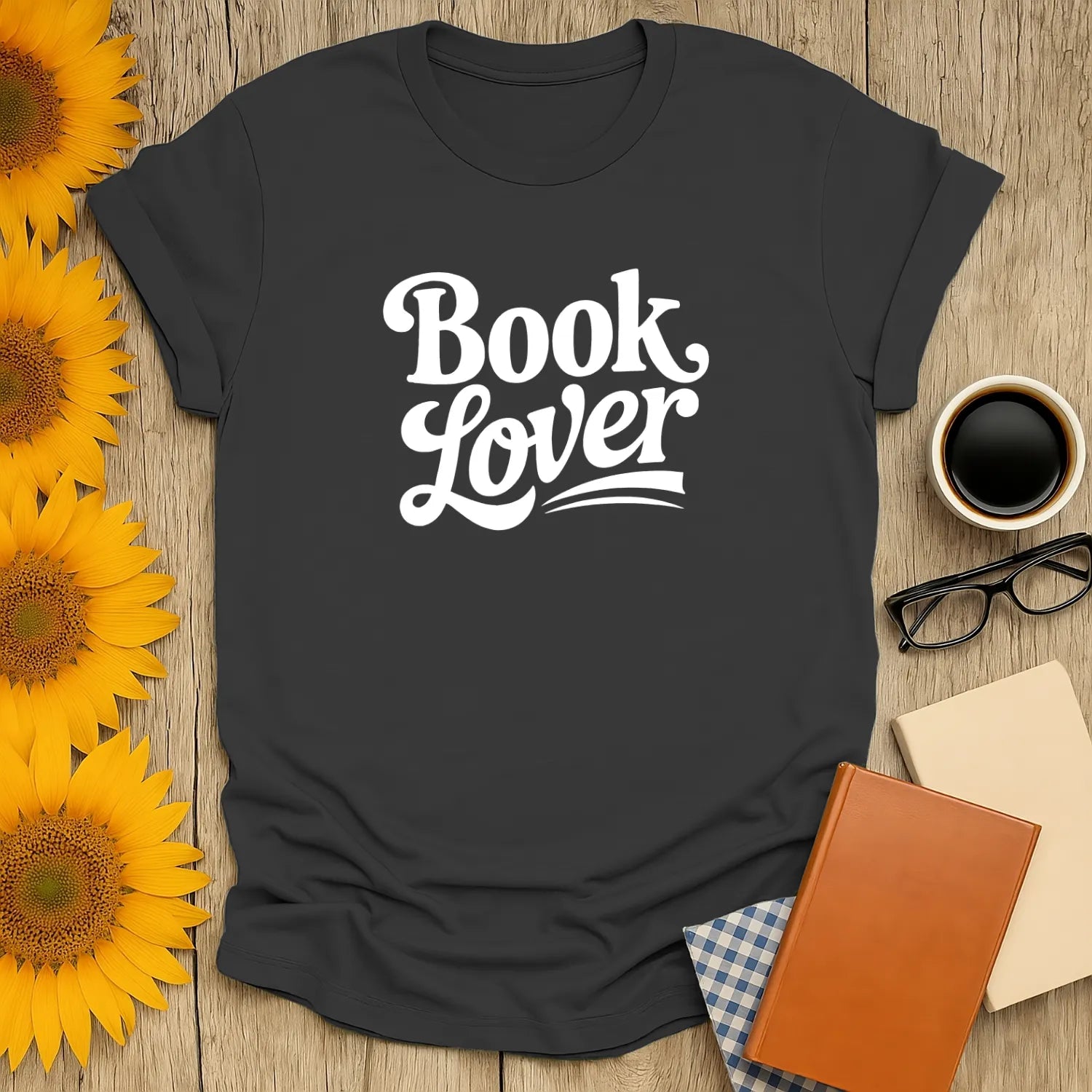 Book lover t-shirt with playful white text, perfect gift for readers who adore coffee and cozy reading moments.