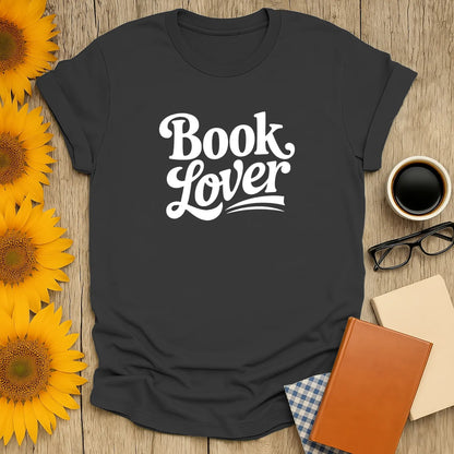 Book lover t-shirt with playful white text, perfect gift for readers who adore coffee and cozy reading moments.