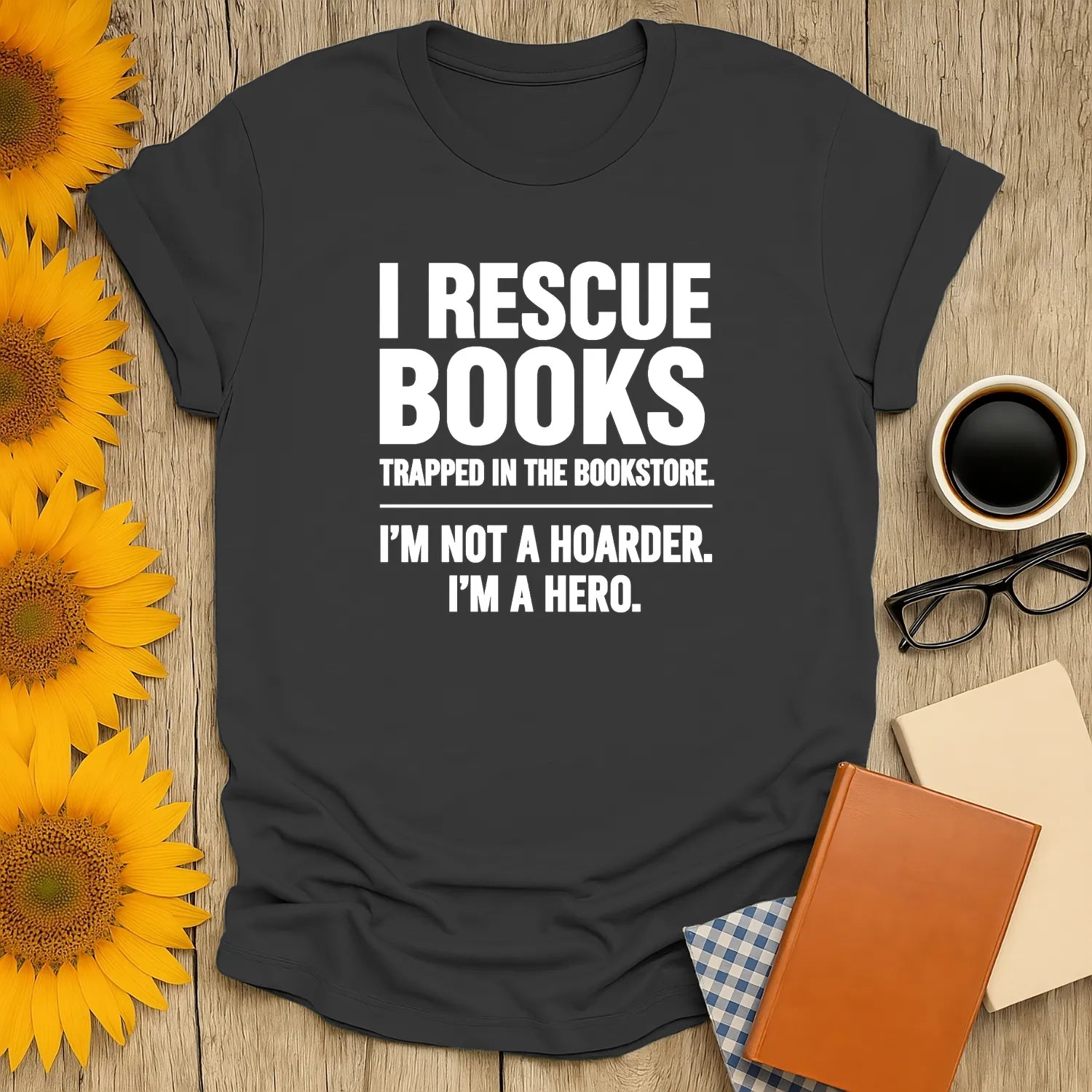 Funny book lover shirt stating "I Rescue Books, I'm Not a Hoarder, I'm a Hero"—a cozy tee for readers who adore cats and coffee.