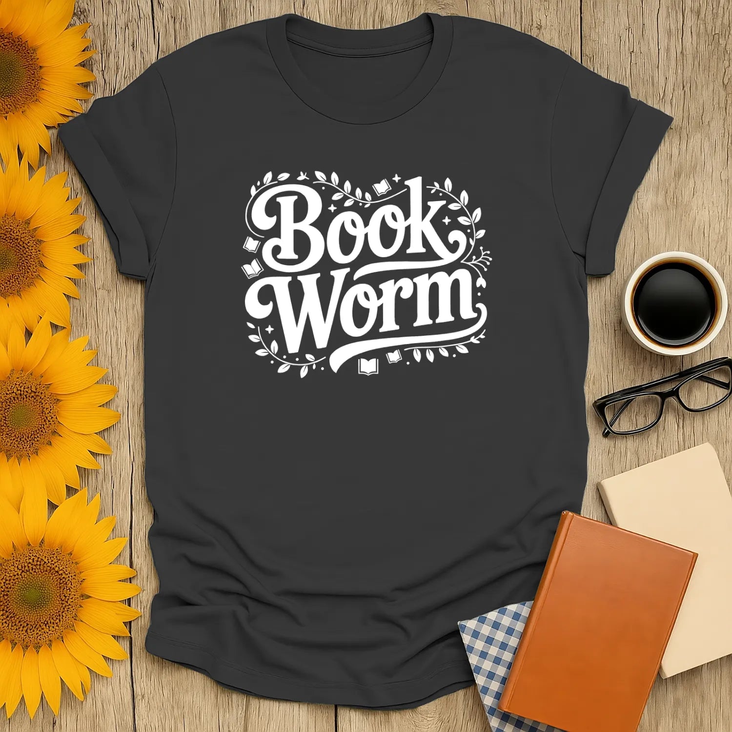 Bookworm Magic T-Shirt featuring 'Book Worm' design surrounded by floral accents, perfect cozy shirt for cat, coffee, or tea lovers.