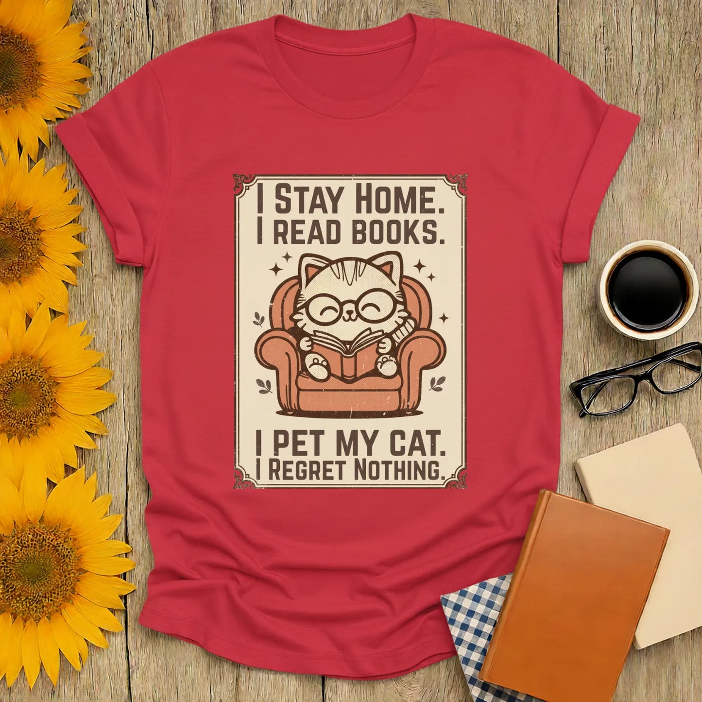 Poster Cat Reader T-Shirt featuring a whimsical cat in glasses, reading in an armchair, perfect for book lovers and cozy tea times.