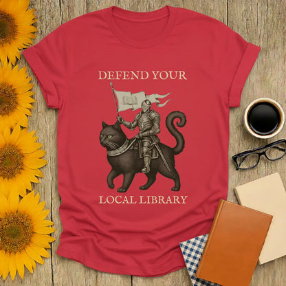 Library Defender T-Shirt features a knight on a cat, with text 'Defend Your Local Library' - perfect for book lovers!