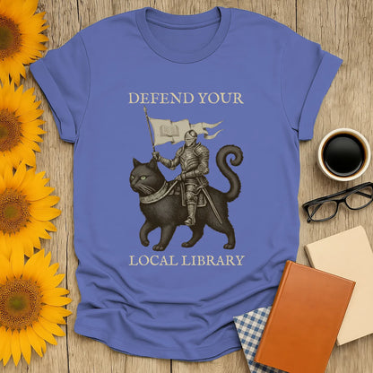Library Defender T-Shirt featuring a knight on a cat with the text "Defend Your Local Library"—perfect for book lovers.
