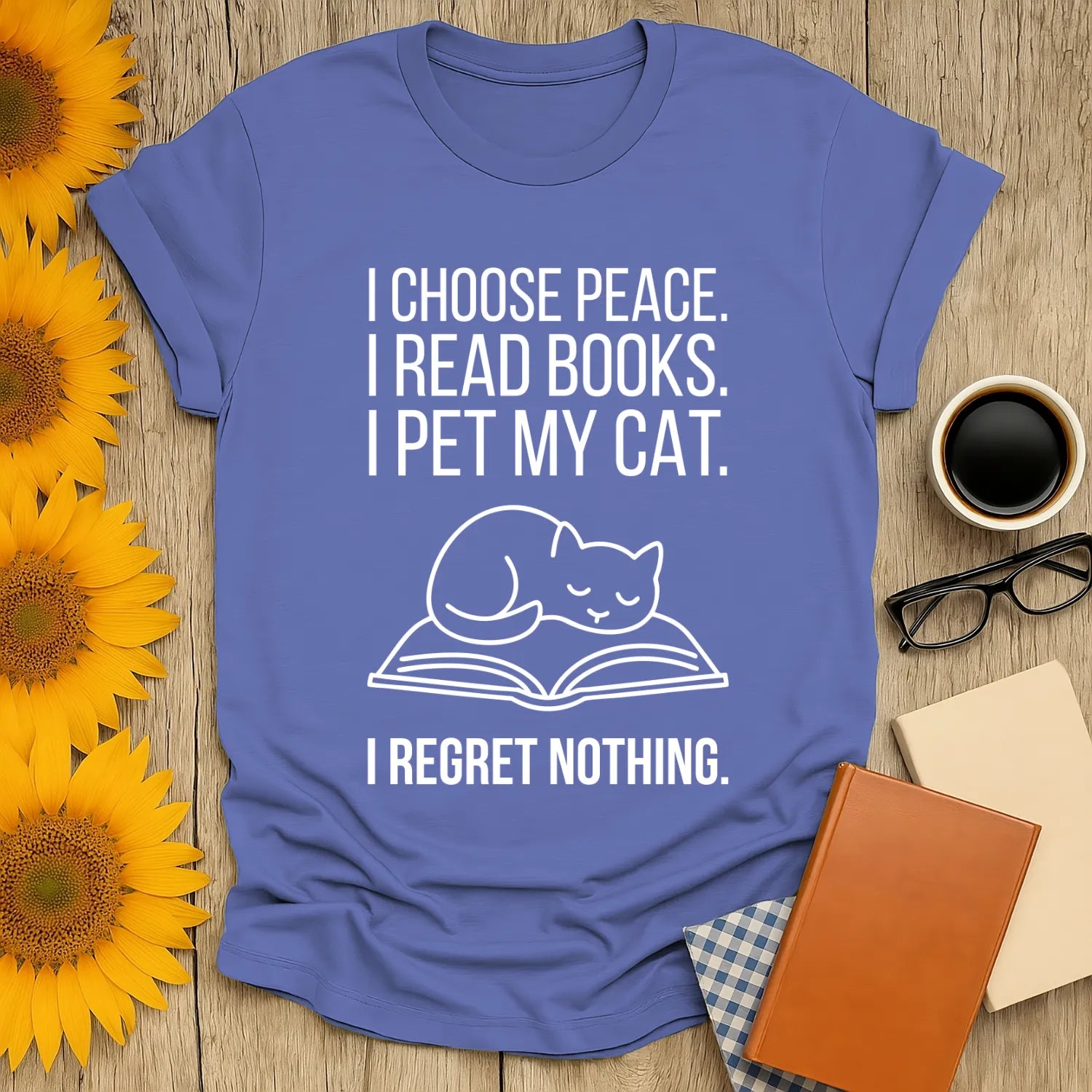 Light blue book lover shirt featuring a cat on an open book with the text: "I choose peace. I read books. I pet my cat. I regret nothing." Perfect for cozy readers!