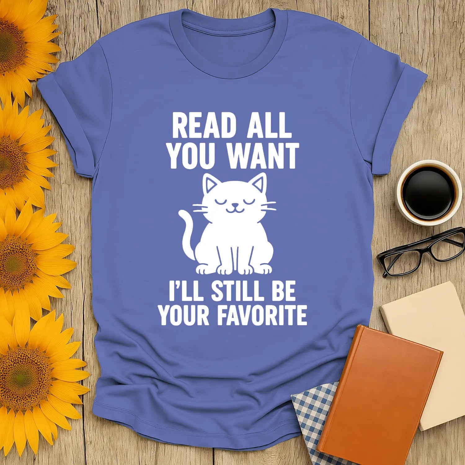 Funny book lover t-shirt with a cat illustration and text: 'Read all you want, I'll still be your favorite'.
