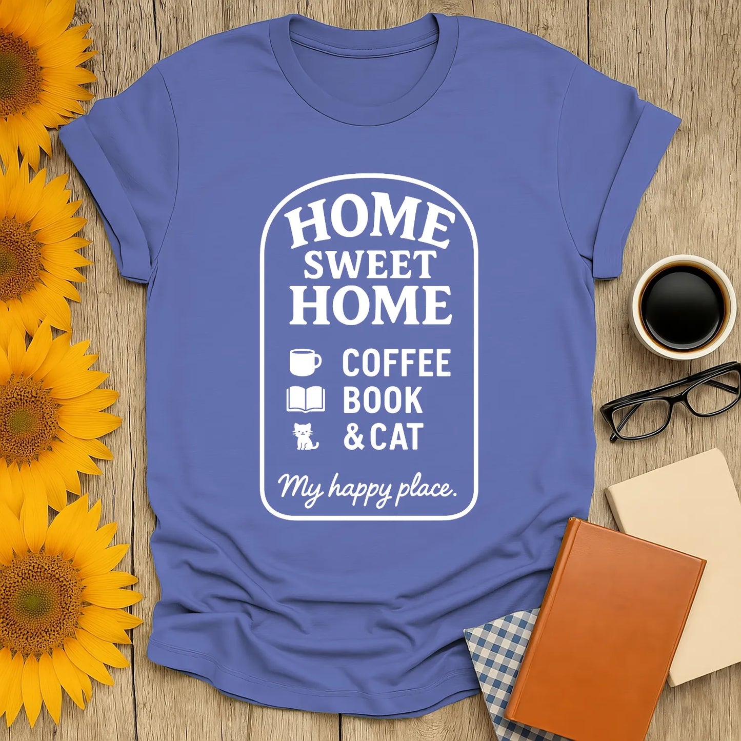 Homebody Bliss T-Shirt featuring 'Home Sweet Home' with coffee, book, and cat icons. Ideal gift for cozy reading lovers!