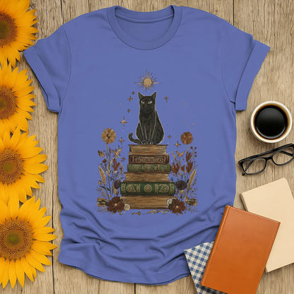 Mystic Cat & Books T-Shirt featuring a black cat atop vintage books, perfect for book lovers who enjoy cats and cozy reads.