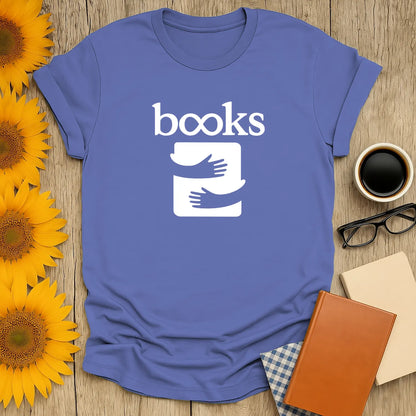 Light blue book lover shirt featuring hands cradling a book, perfect gift for cozy readers who adore cats, coffee, and bookish humor.