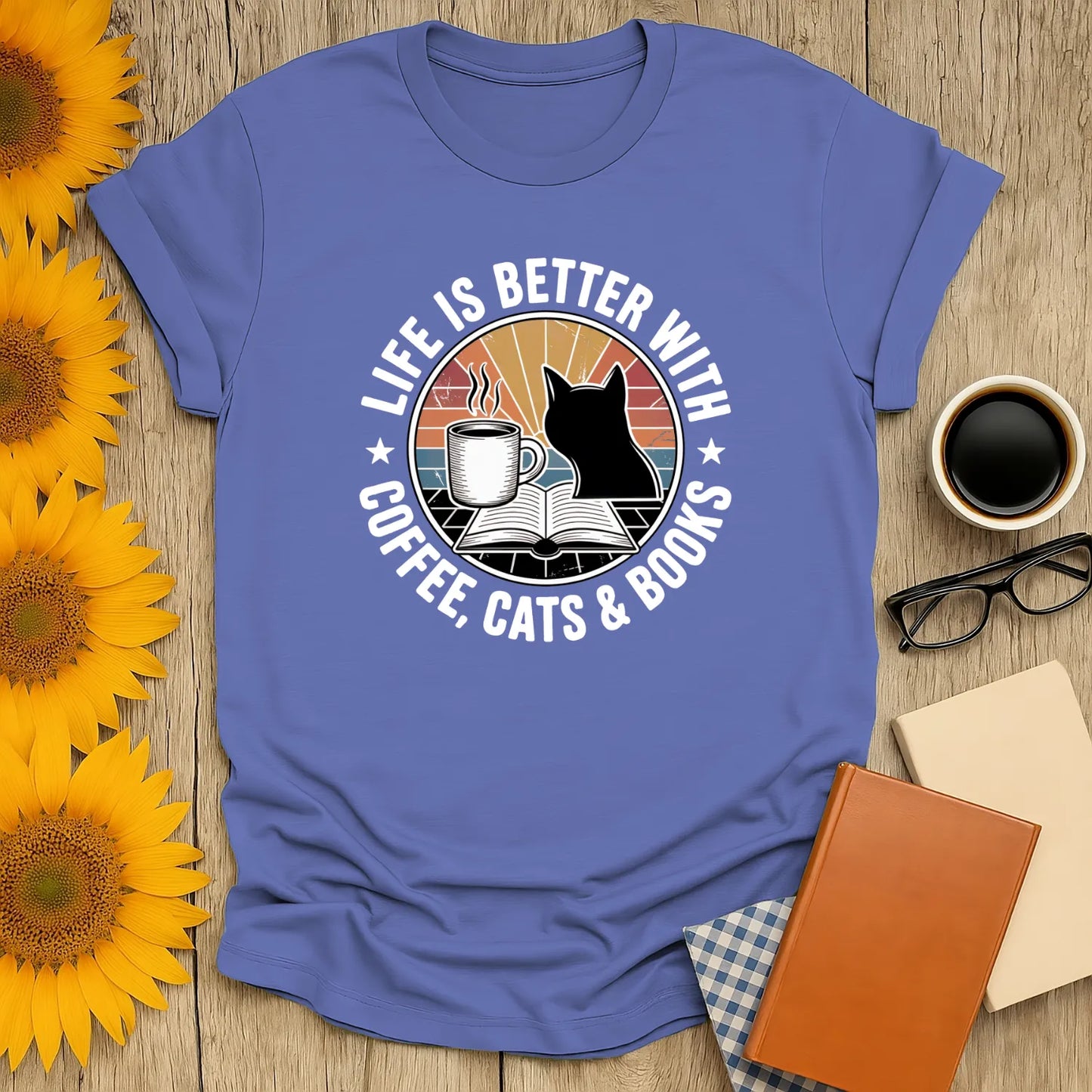 Life is better with coffee, cats & books design on tee; perfect for book lovers and cozy reading moments.