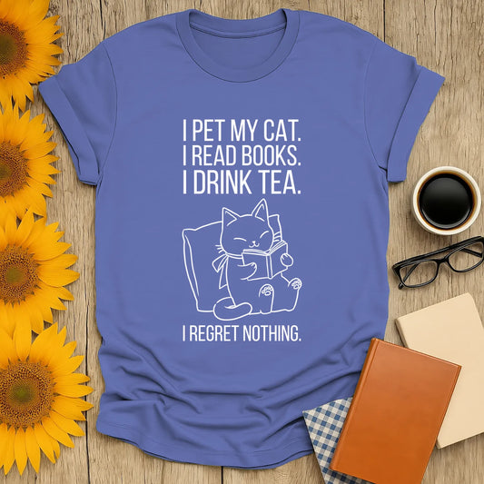 Cozy blue t-shirt with a playful cat illustration and text: "I pet my cat. I read books. I drink tea. I regret nothing." Perfect for book lovers.