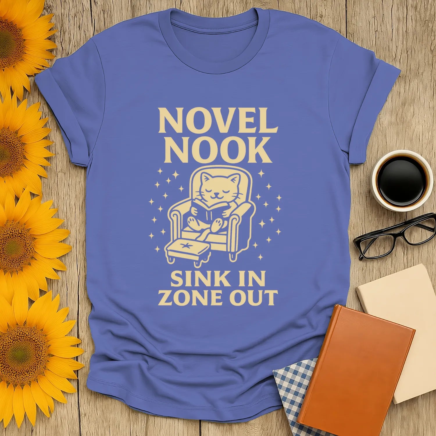 Cozy Novel Nook T-shirt with a cat reading, perfect for book lovers who enjoy cats, coffee, or tea.