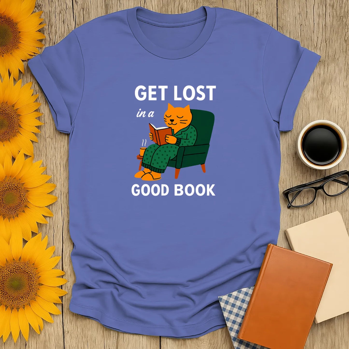 Funny cat reading shirt featuring a cozy cat in a chair, reading with the text "Get Lost in a Good Book". Perfect gift for book lovers.