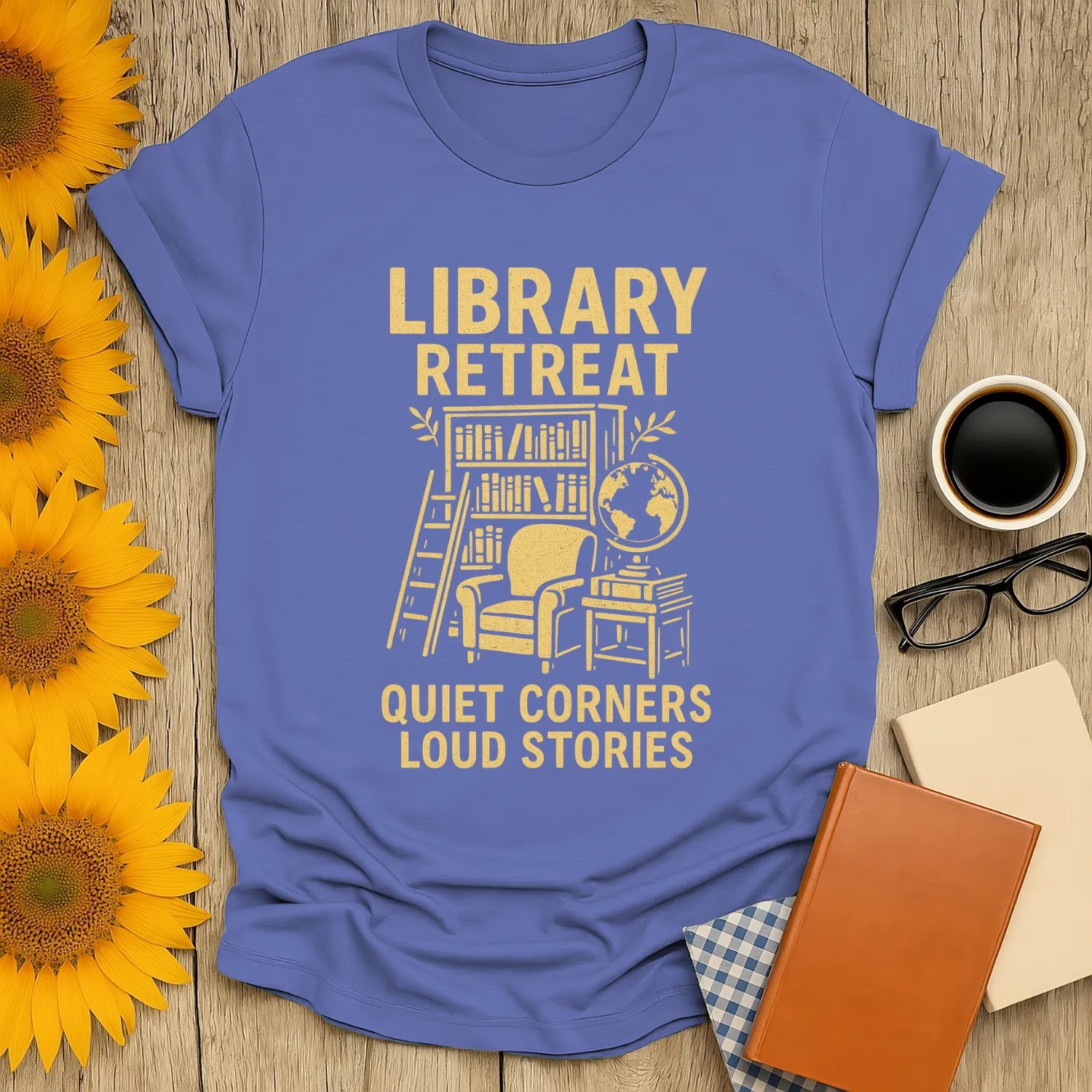 Cozy Library Retreat T-Shirt featuring a reading nook, globe, and text: 'Quiet Corners Loud Stories' – perfect gift for book lovers.