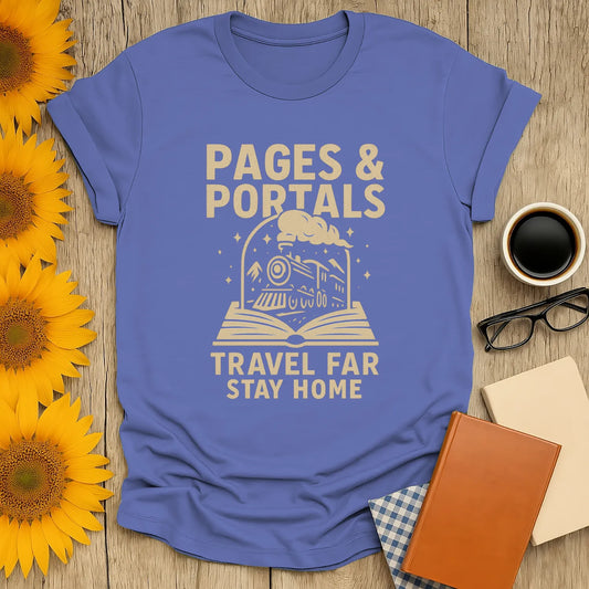 Whimsical blue tee featuring a train from an open book, text: 'Pages & Portals - Travel Far, Stay Home'. Perfect gift for book lovers.