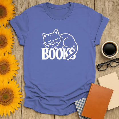 Cozy blue cat reading shirt with a playful cat asleep on the word 'BOOKS', perfect for book lovers and thoughtful gifts.