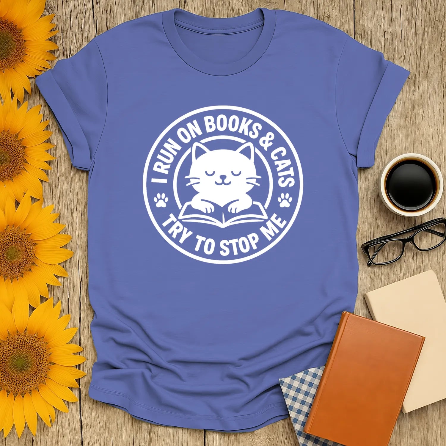 Cozy cat reading shirt featuring a cute cat graphic and text: 'I Run On Books & Cats, Try to Stop Me.' Perfect gift for book lovers.