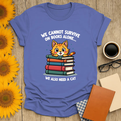 Purrfect Reader T-shirt featuring a cute cat on stacked books and text: 'We cannot survive on books alone... We also need a cat.' Perfect for book lovers.
