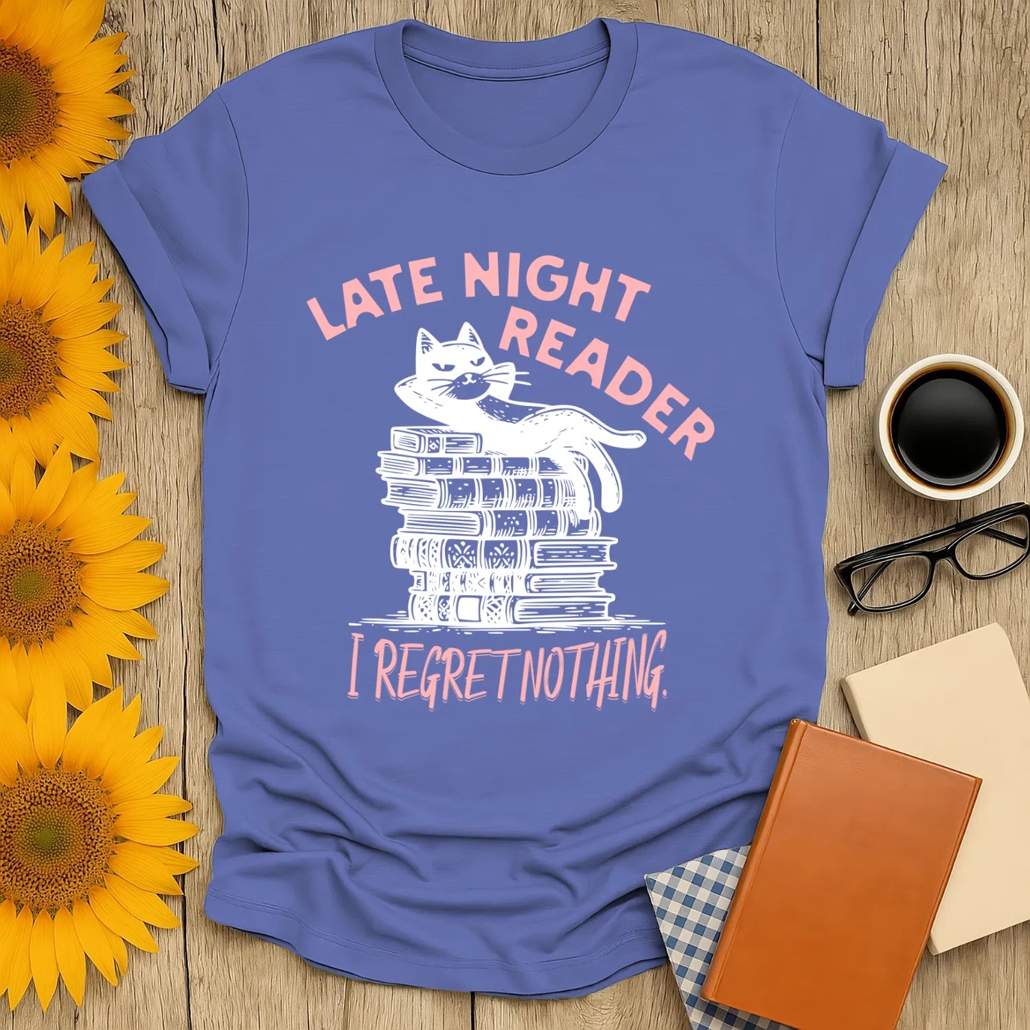 Late Night Reader T-Shirt featuring a relaxed cat on books with 'I Regret Nothing,' perfect for cozy book lovers.
