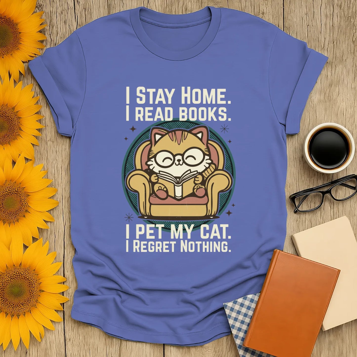 Retro Cat Reader T-Shirt featuring a cartoon cat in glasses, reading in an armchair with a humorous quote, perfect for book lovers.