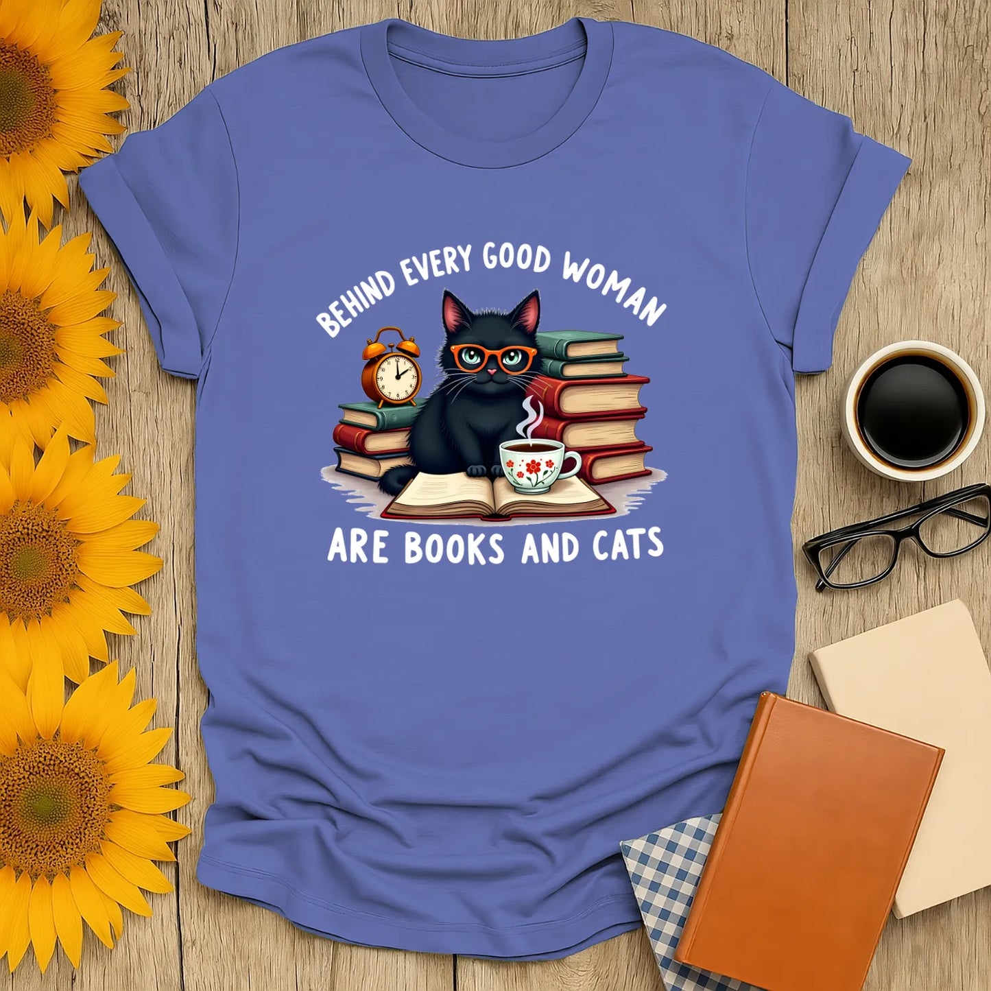 Whimsical ‘Behind Every Good Woman’ tee with a cute cat, books, and tea—perfect gift for book lovers and cat fans.