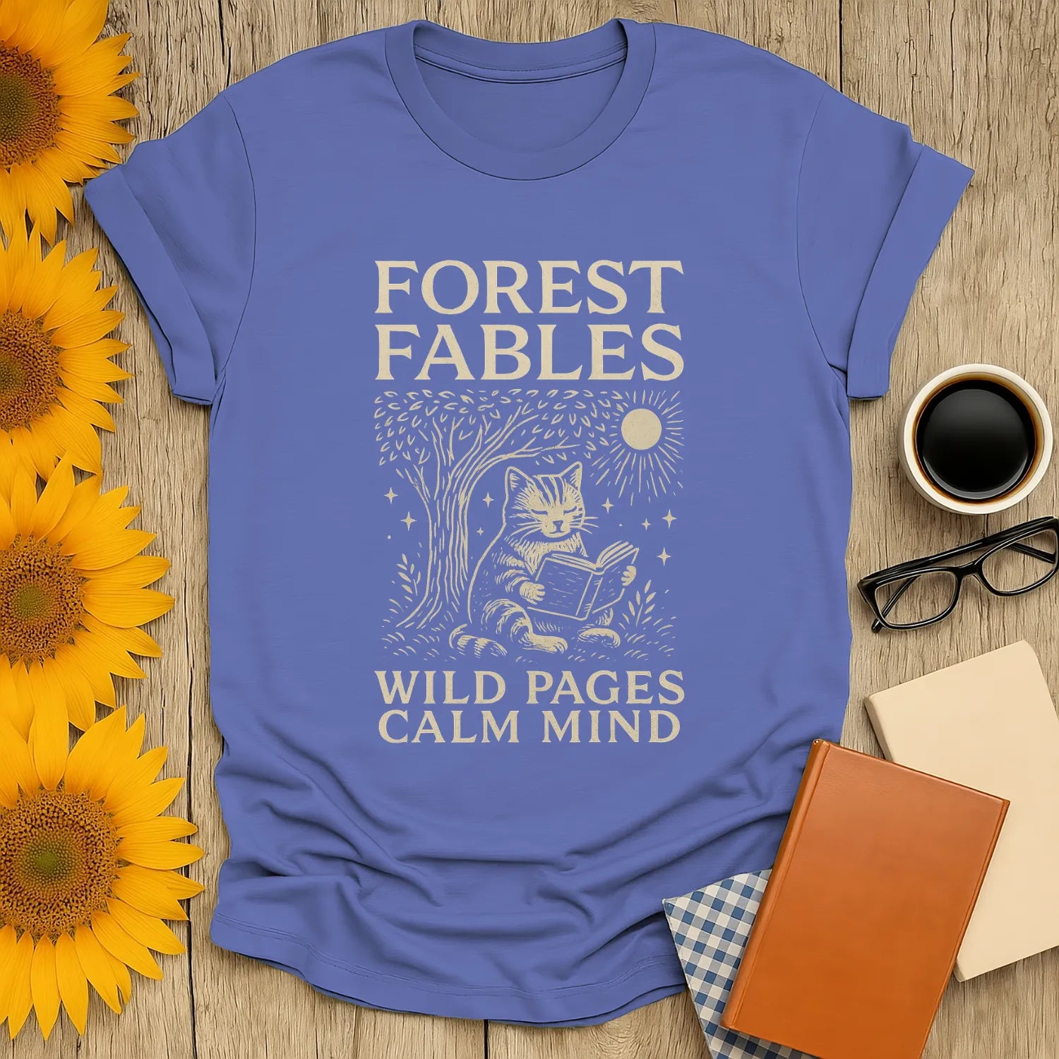 Whimsical Forest Fables T-Shirt featuring a cat reading under a tree, perfect for book lovers and cozy vibes.