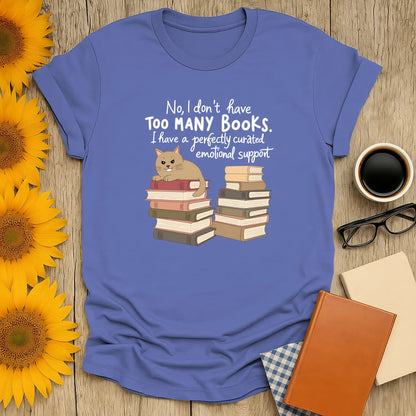 Emotional Support Books T-Shirt in organic cotton, relaxed fit, features a cat on a stack of books, perfect gift for readers 📖.