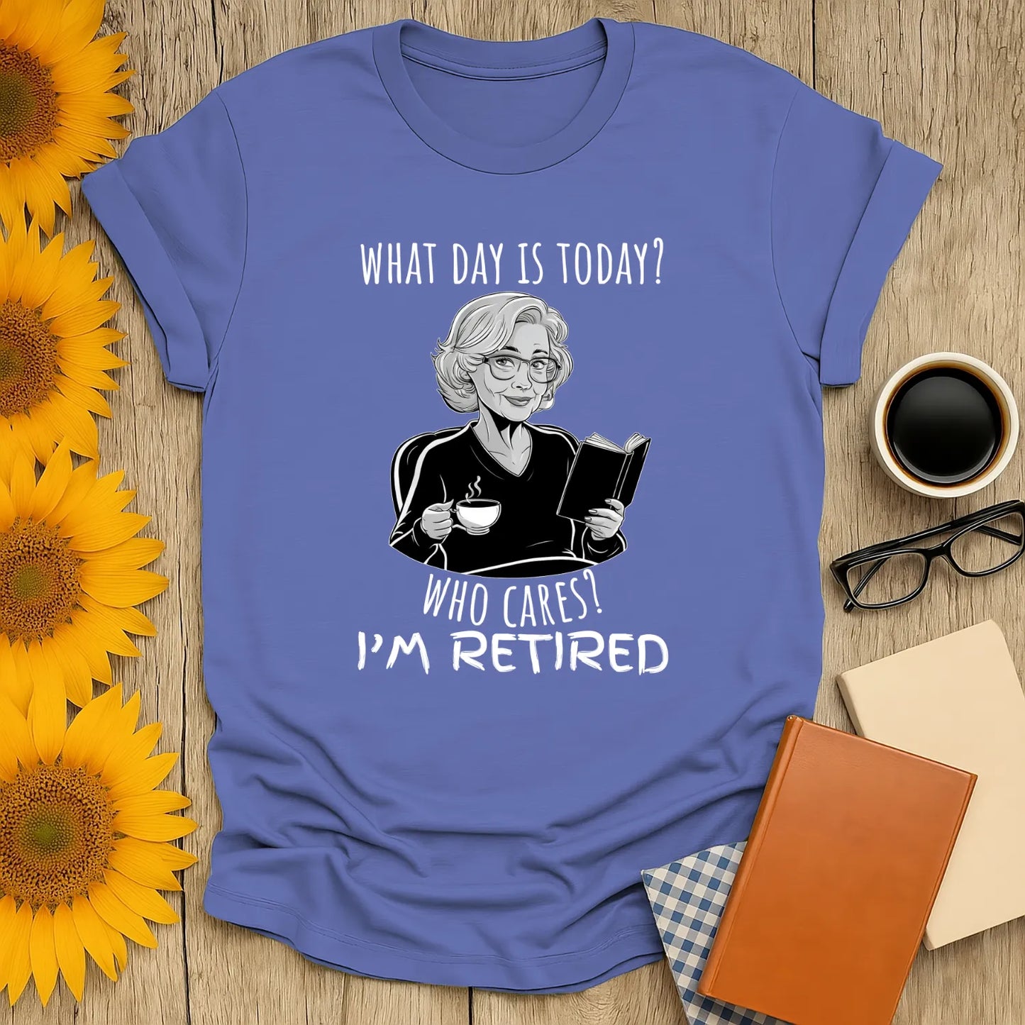 What Day is It? T-Shirt featuring a relaxed fit unisex design of a retired woman reading and enjoying coffee ☕️, perfect for book lovers!