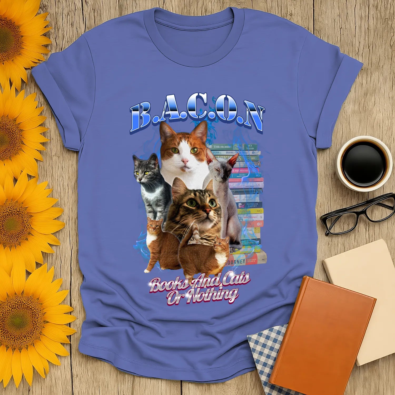 A cozy blue Books & Cats Or Nothing T-Shirt featuring playful cats and stacked books, perfect for book lovers and cat enthusiasts.