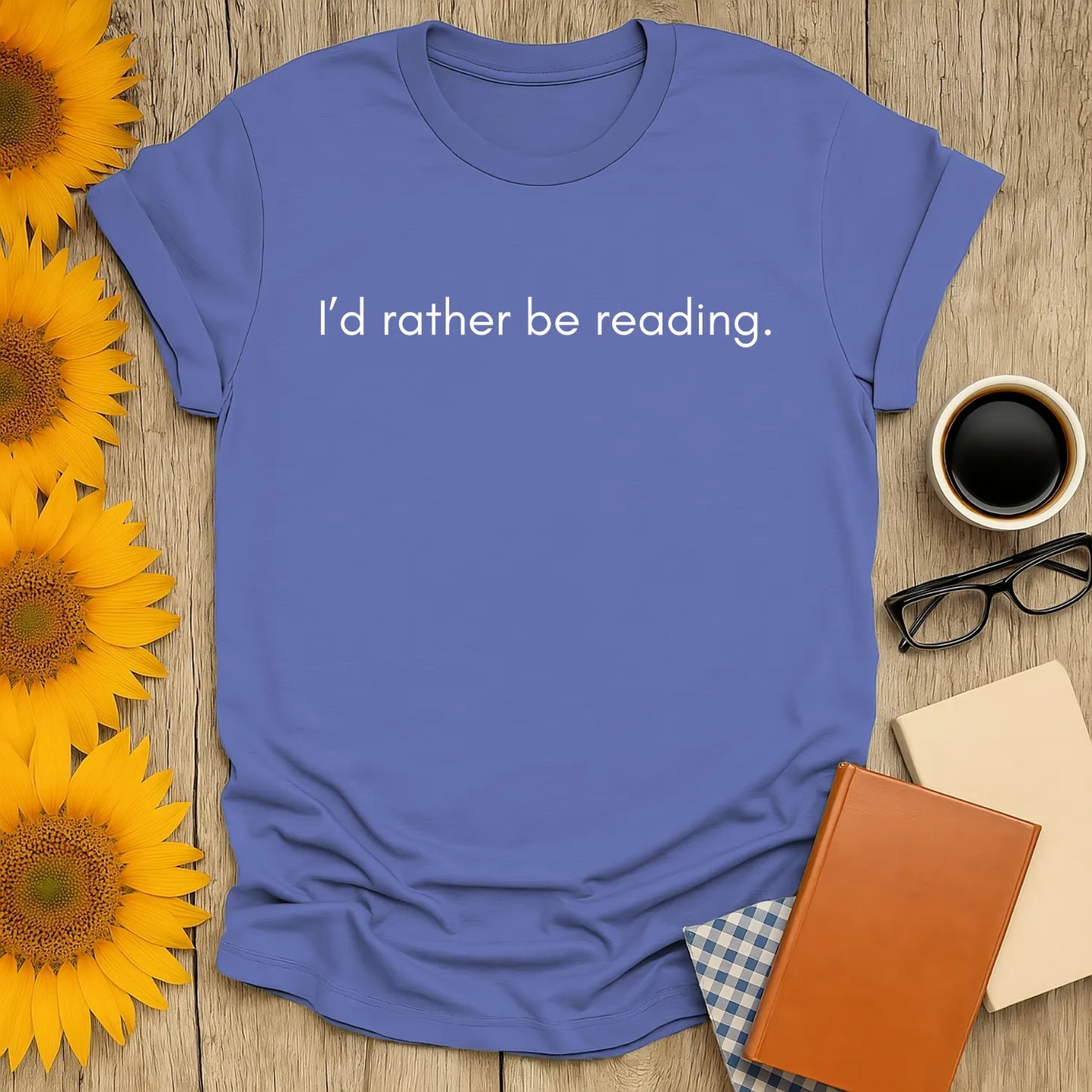 Cozy blue t-shirt with 'I’d rather be reading.' text, perfect gift for book lovers with coffee, cats, and humor.