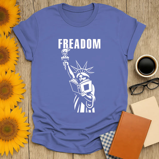 Freadom Statue T-Shirt featuring Lady Liberty reading a book, perfect for book lovers and a cozy gift for readers.