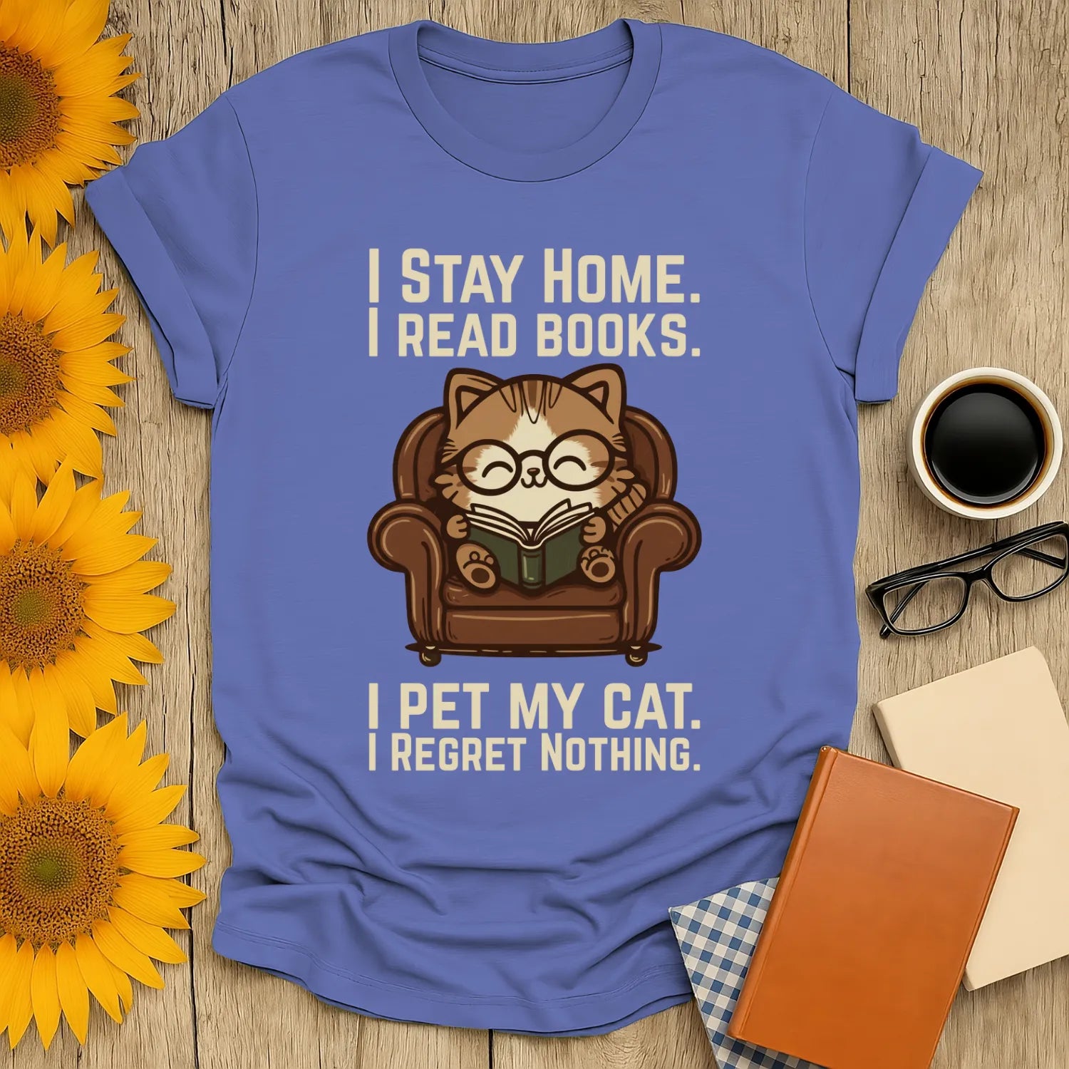 Armchair Cat Reader T-Shirt featuring a cozy cat in glasses reading on a big armchair, perfect for book lovers and cat enthusiasts.