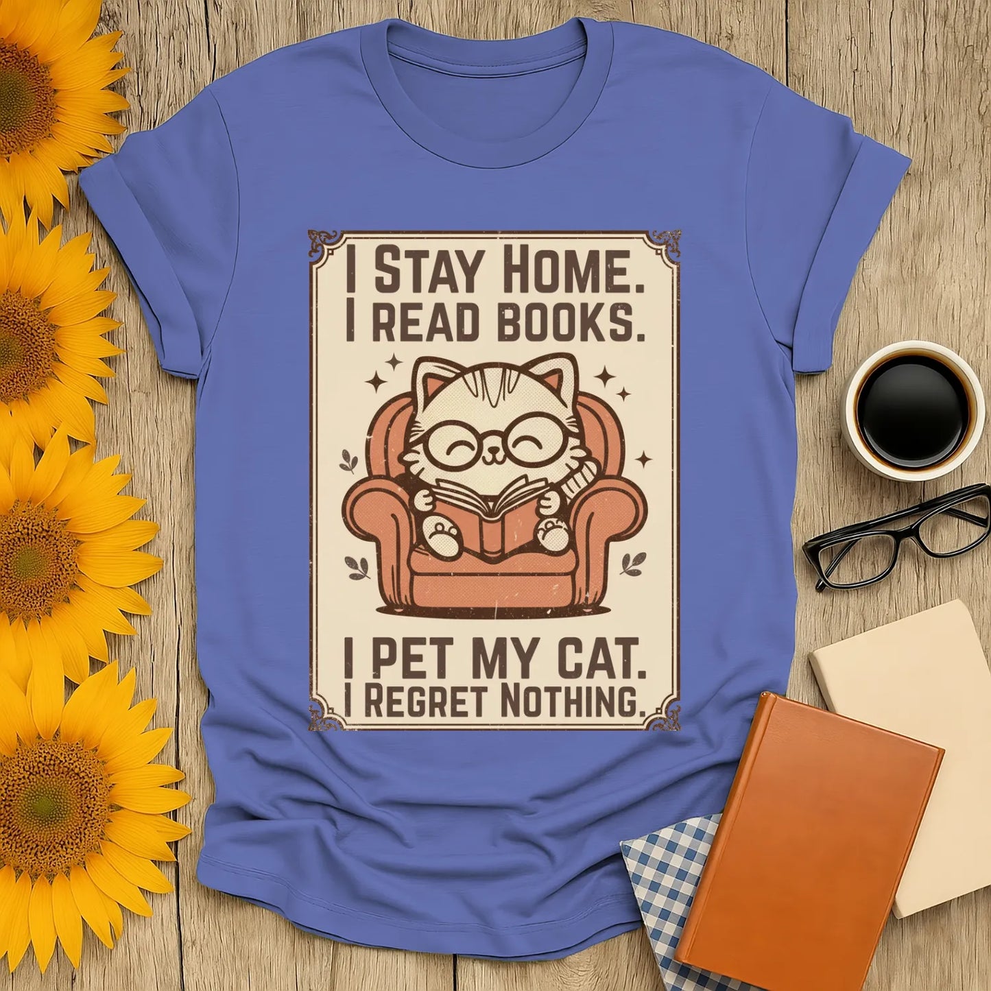Poster Cat Reader T-Shirt featuring a charming cat with glasses reading comfortably in an armchair, perfect for book lovers.