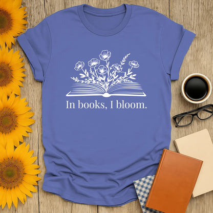 Cozy book lover shirt with blooming flowers and text 'In books, I bloom.' Perfect gift for readers who adore cats and coffee.