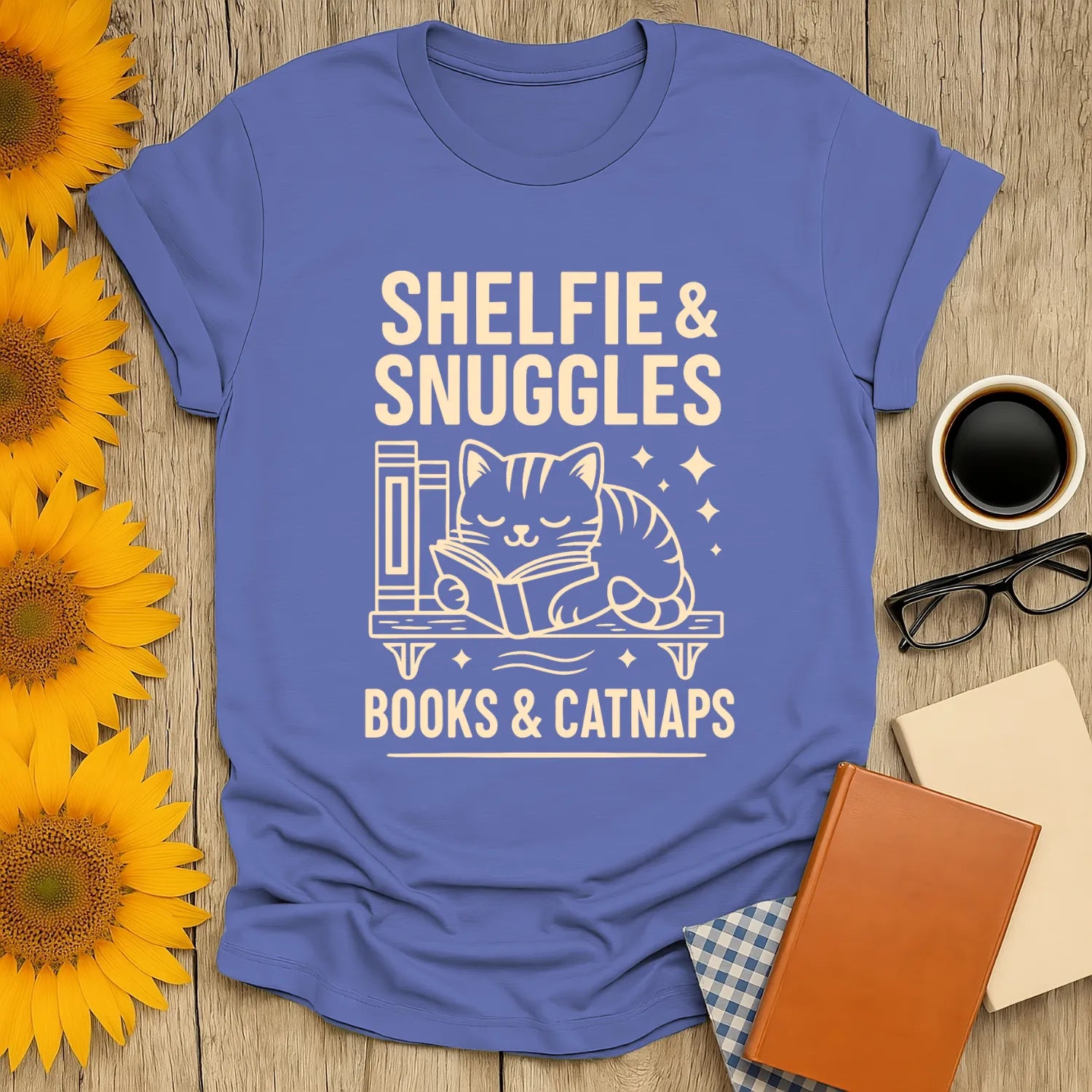 Shelfie & Snuggles T-shirt with a cute cat reading among books, perfect for cozy book lovers and gifts for readers.