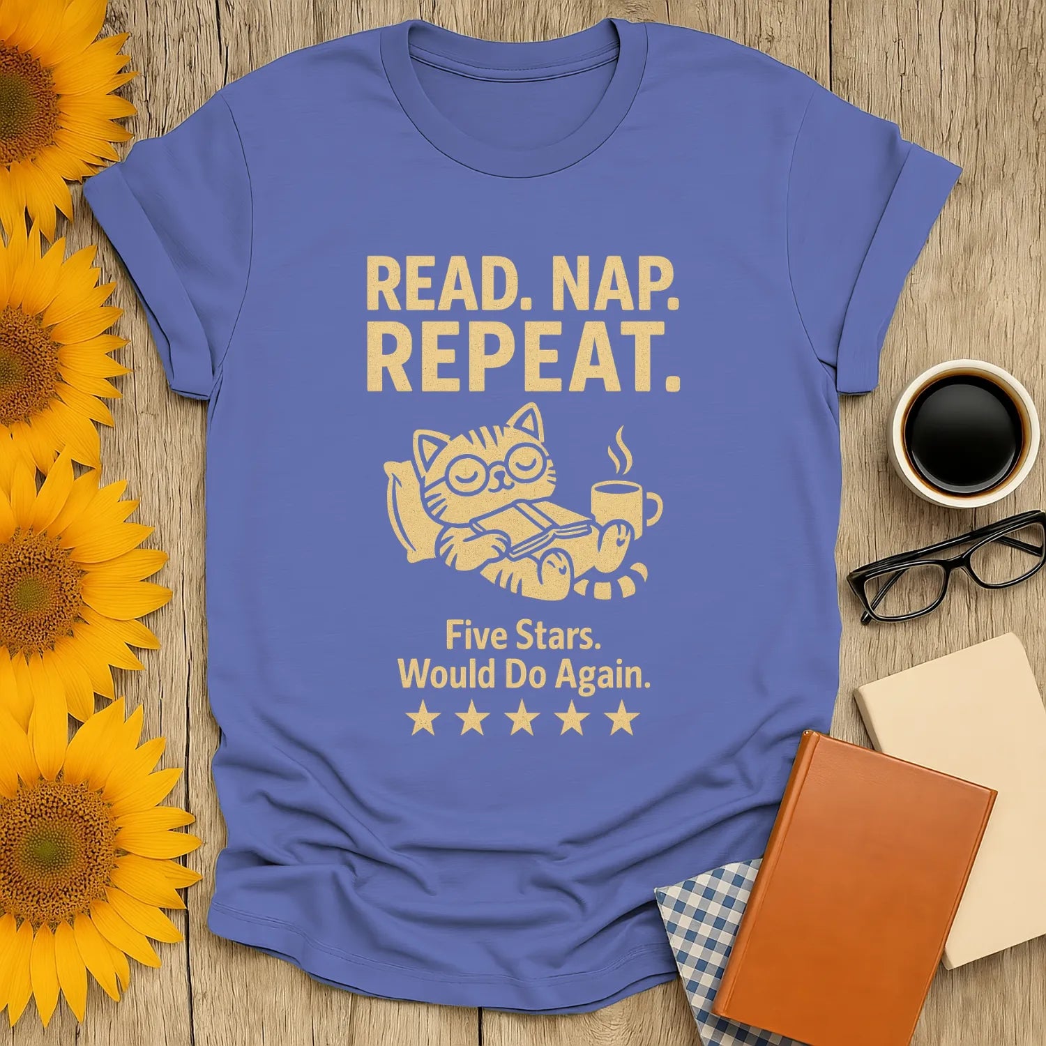 Cozy book lover shirt featuring a content cat with coffee, saying 'Read. Nap. Repeat. Five Stars. Would Do Again.' Perfect gift for readers!