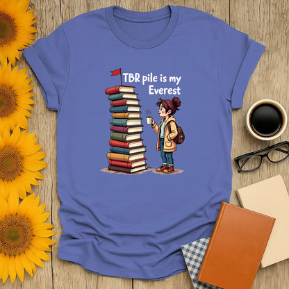 Bookish Everest T-Shirt featuring a cute reader and stacked books. Relaxed fit unisex tee, perfect gift for book lovers 📖.