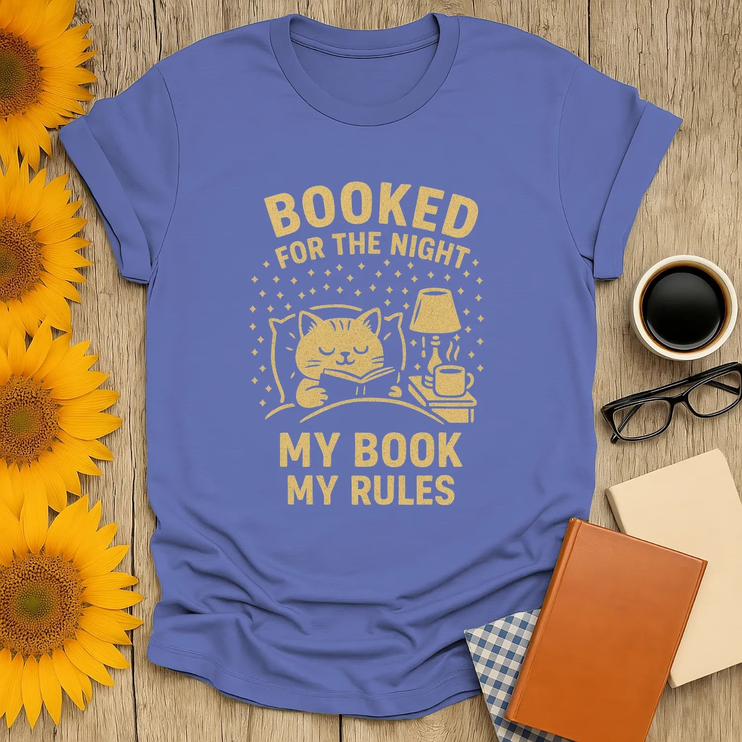 Cozy cat with book and coffee on the Booked for the Night t-shirt; perfect gift for book lovers and cat fans.