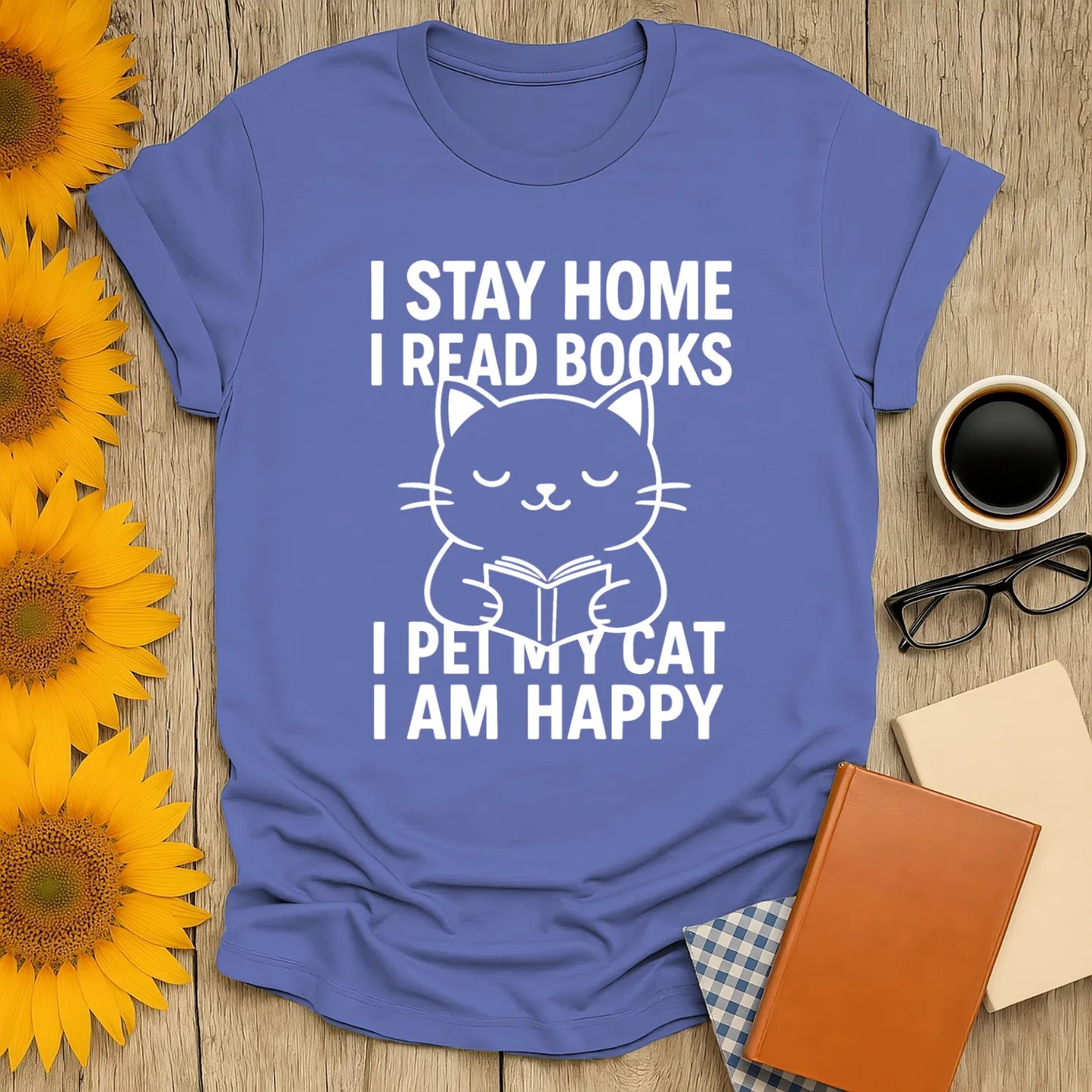 Happy Cat Reader T-Shirt featuring a cute cat illustration with text: I stay home, I read books, I pet my cat, I am happy.