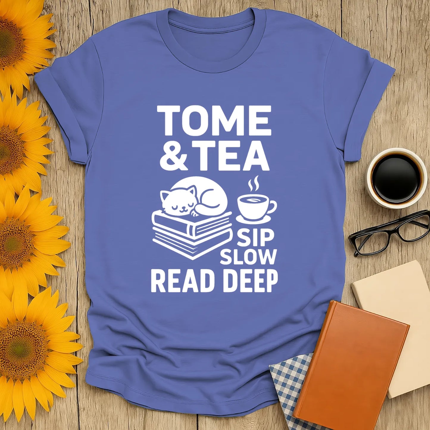 Cozy Tome & Tea shirt with a cat napping on books and a steaming cup, perfect for book lovers and gifts for readers.
