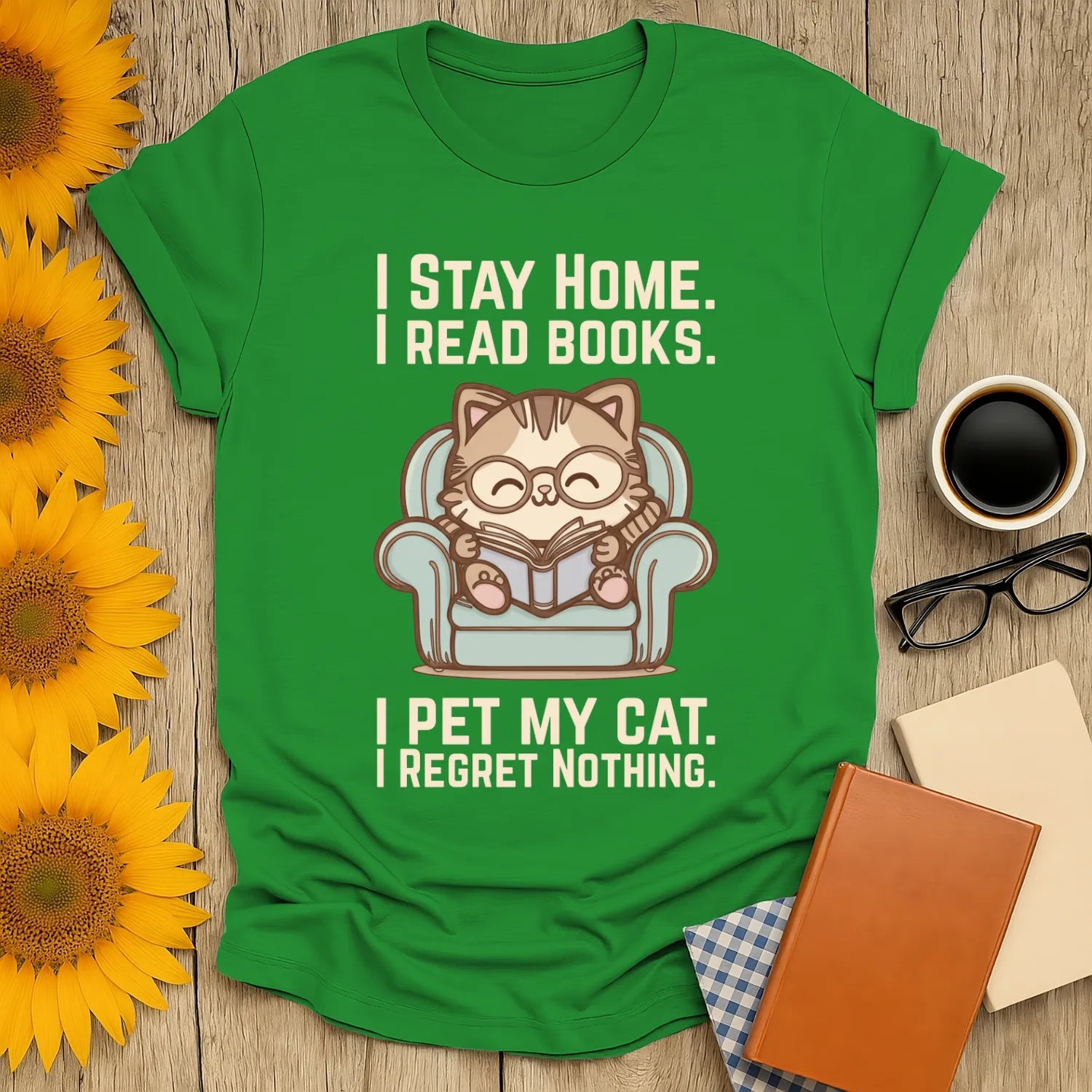 Comfy Cat Reader T-Shirt with a cat reading in a chair, stating "I Stay Home. I Read Books. I Pet My Cat. I Regret Nothing." Perfect for book lovers.