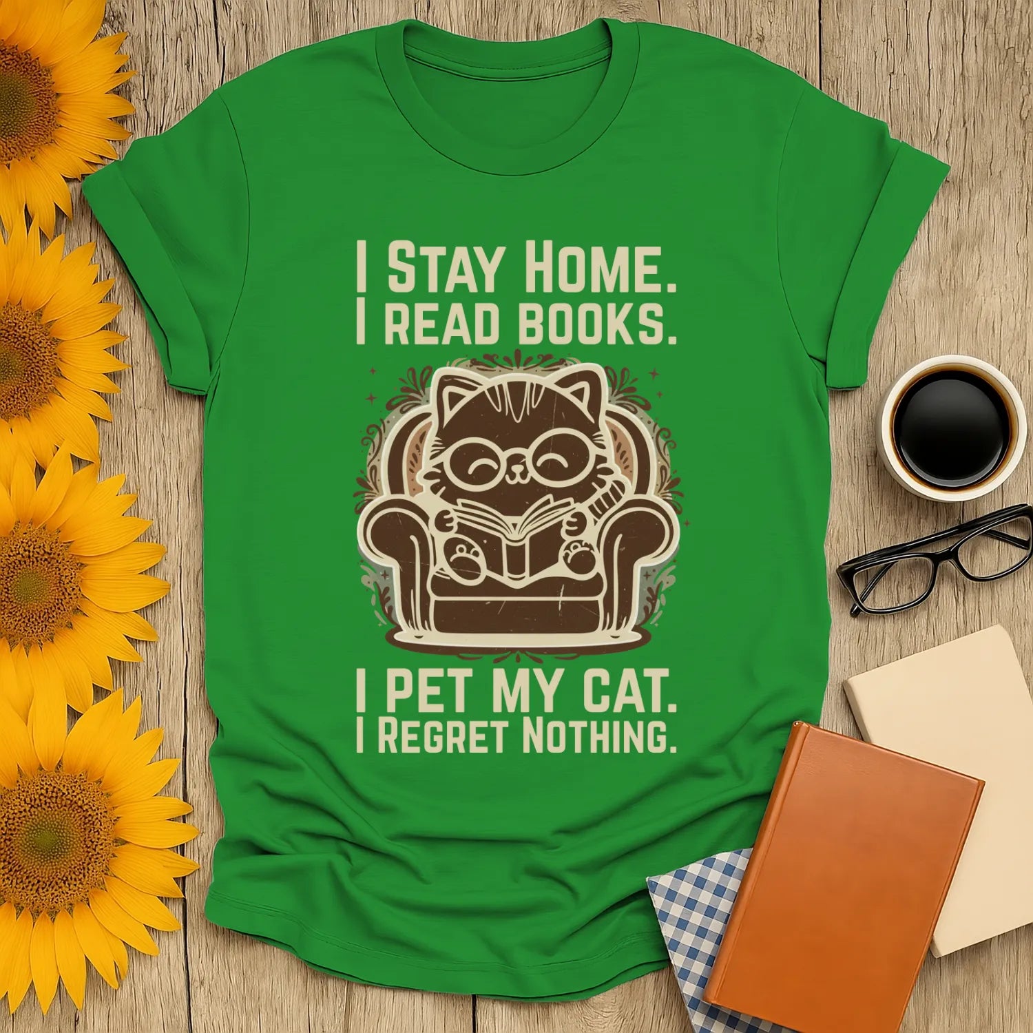 Ornament Cat Reader T-Shirt featuring a witty design: a cat with glasses reading in an armchair, saying, I stay home. I read books.