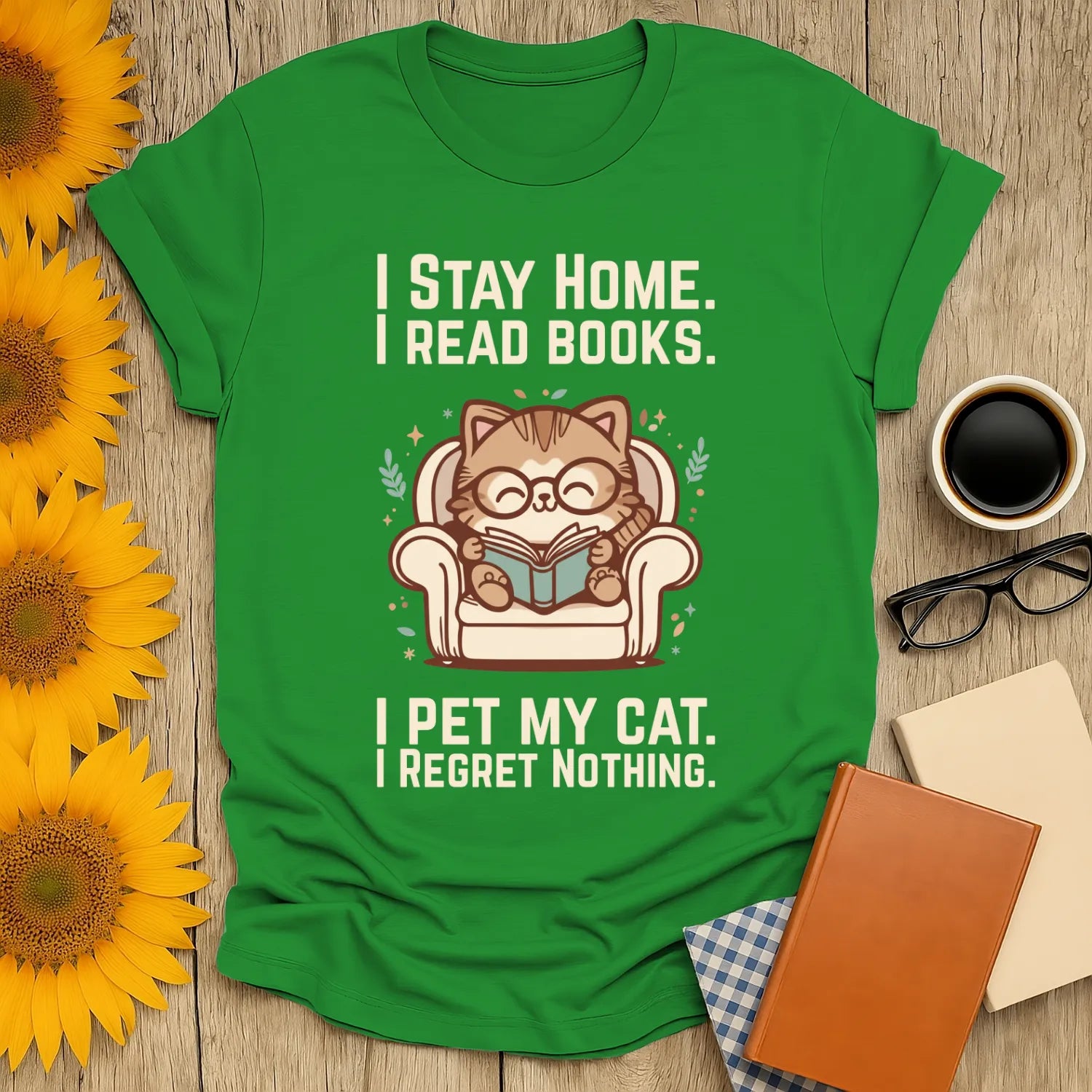 Homebody Cat Reader T-Shirt showing a cat with glasses reading in a cozy chair, humorous text celebrating bookworms and cat lovers.