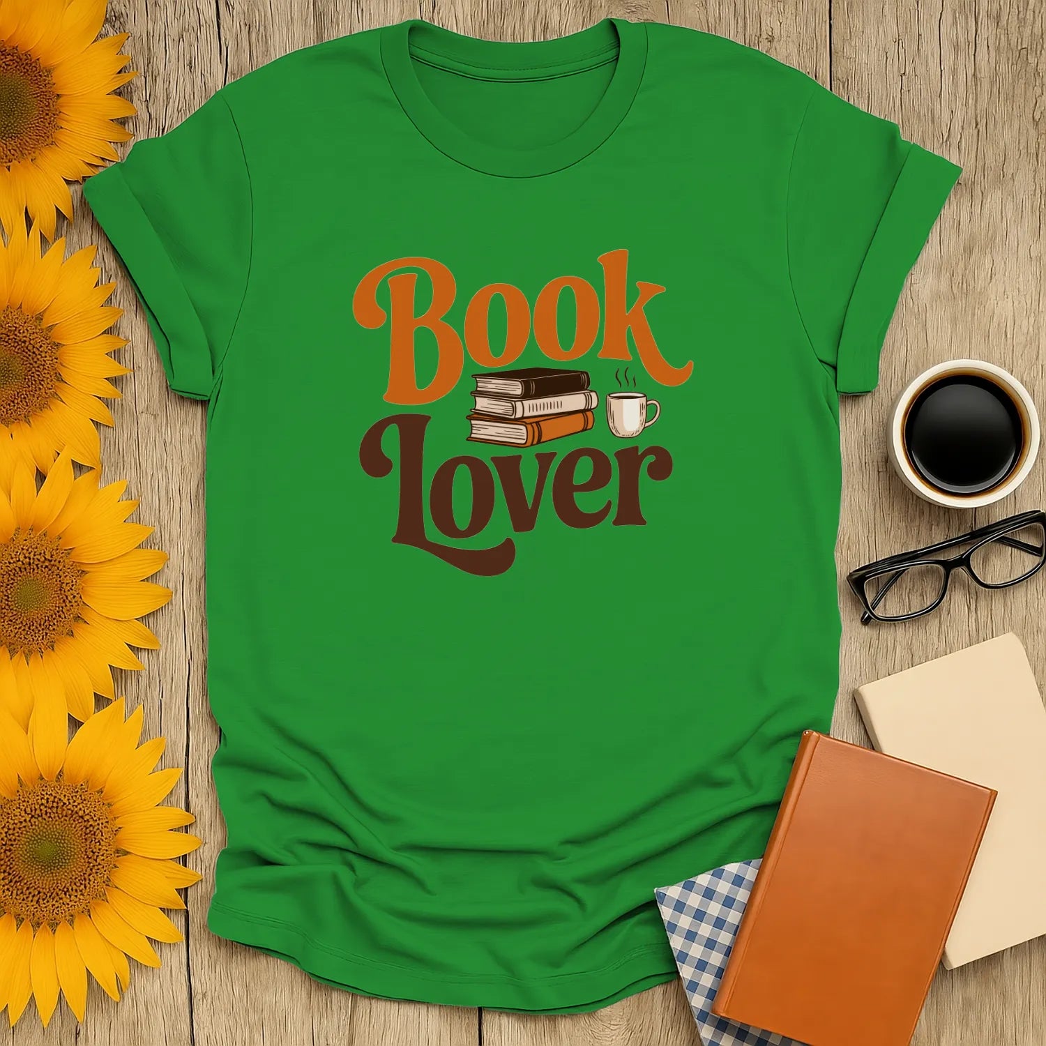 Vibrant green 'Book Lover' t-shirt featuring playful book and coffee graphics—perfect for cozy reading moments.