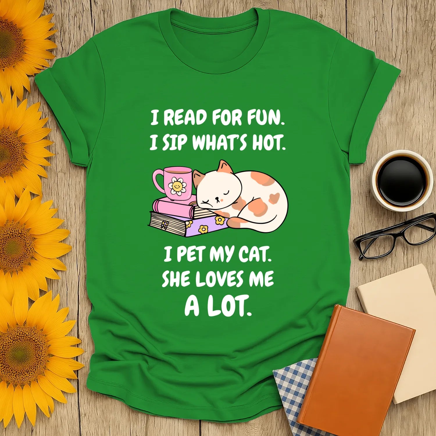 Cheerful green t-shirt with colorful cat illustration, coffee cup, and text about reading and cats. Perfect for book lovers!