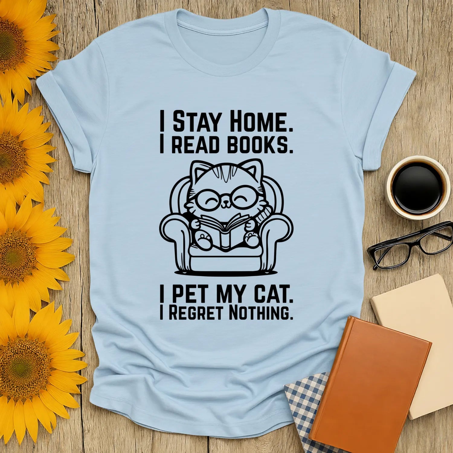 No Regrets, Just Cats T-Shirt featuring a cat reading on a cozy chair, perfect for book lovers and cat enthusiasts.